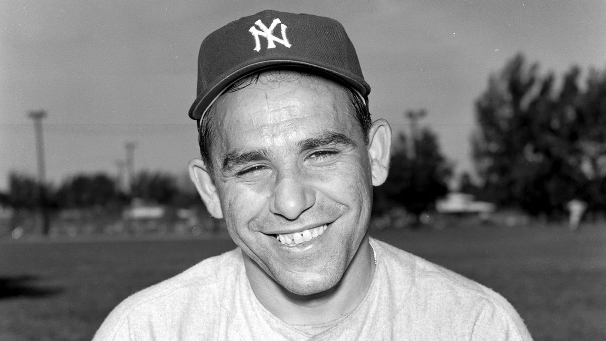 Yogi Berra smiling with a NY Yankees cap