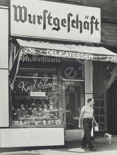 Black and white photo of a German deli with the store name 'Wurstgeschäft'