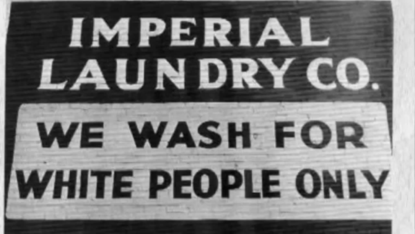 Photo of Imperial Laundry Co. saying "We wash for white people only".