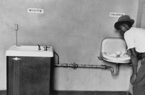 Image showing the segregation of drinking fountains between white and black people.