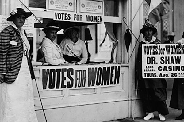 Image with Votes for Women signs.