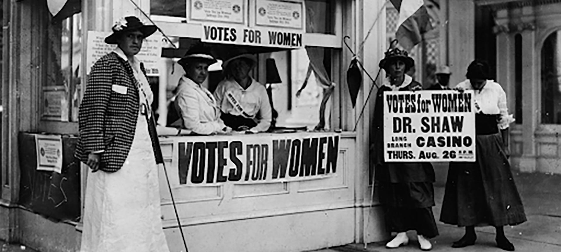 Image with Votes for Women signs.
