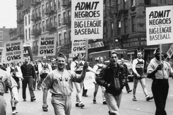 People marching holding signs for African American rights.