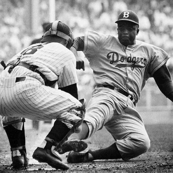 Action shot of Jackie Robinson stealing home in the 1955 World Series