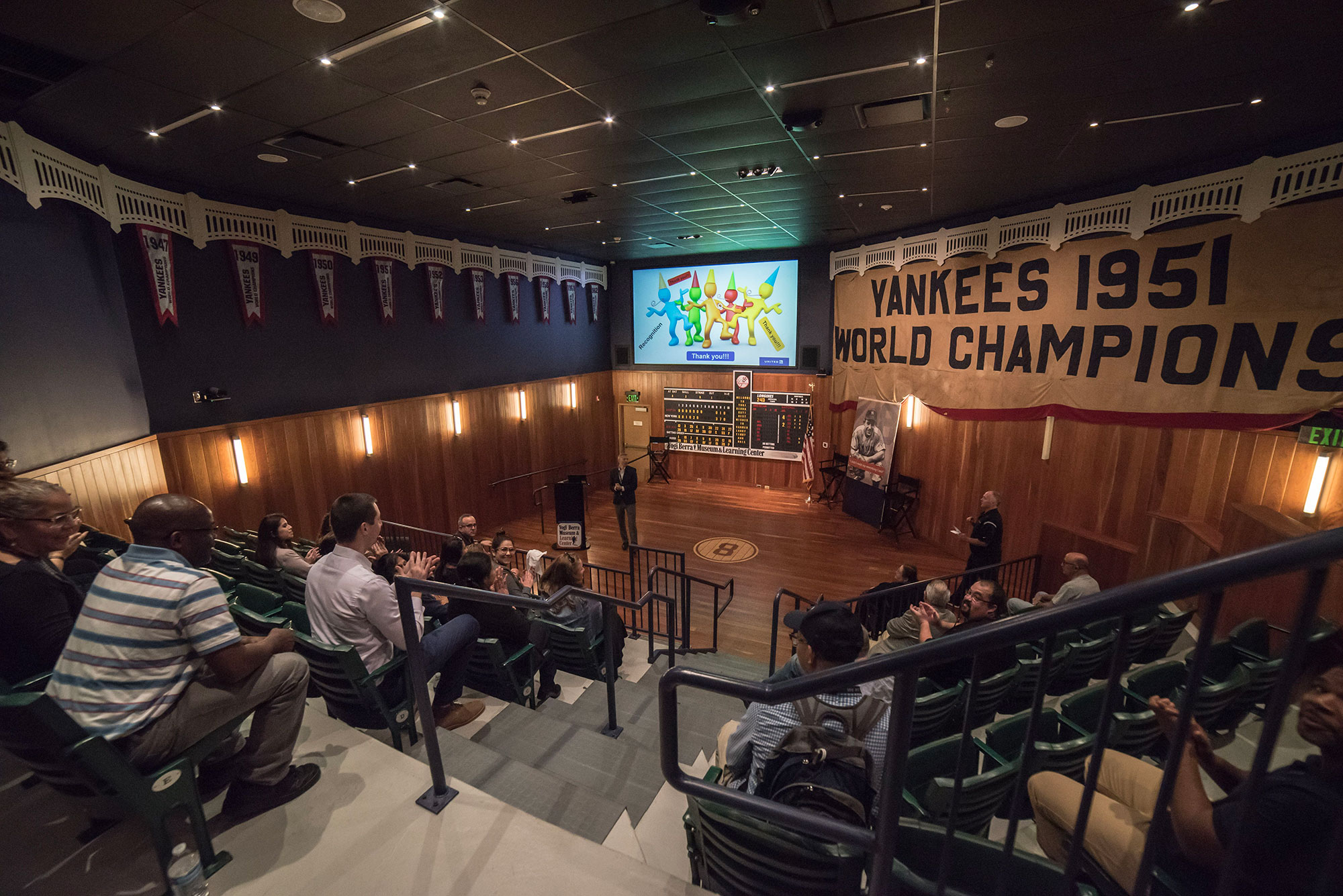 The Museum's 65-seat stadium-style theater filled with visitors